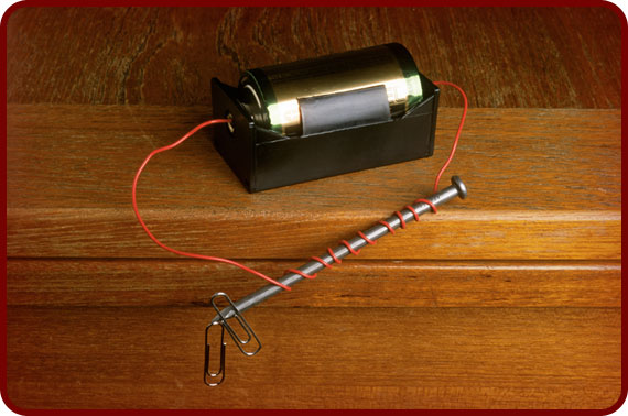 An electromagnet, like this one, can be made using an iron nail and a 6-volt battery.